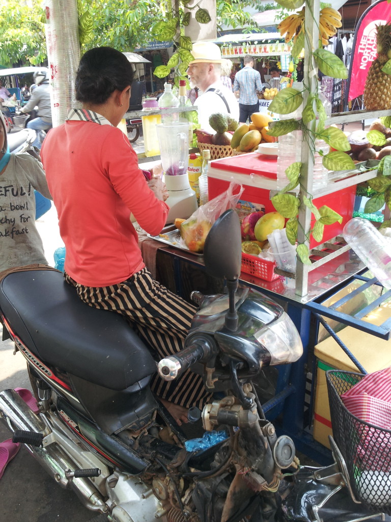It is not just a smoothie stand, it's also a moped!